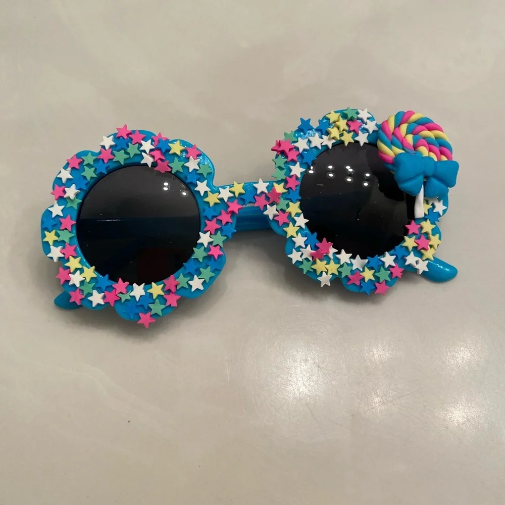 Girls electric blue flower shaped sunglasses
